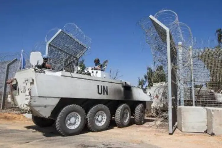 
	Blindado dos Capacetes Azuis da ONU nas Colinas de Gol&atilde;
 (Jack Guez/AFP)