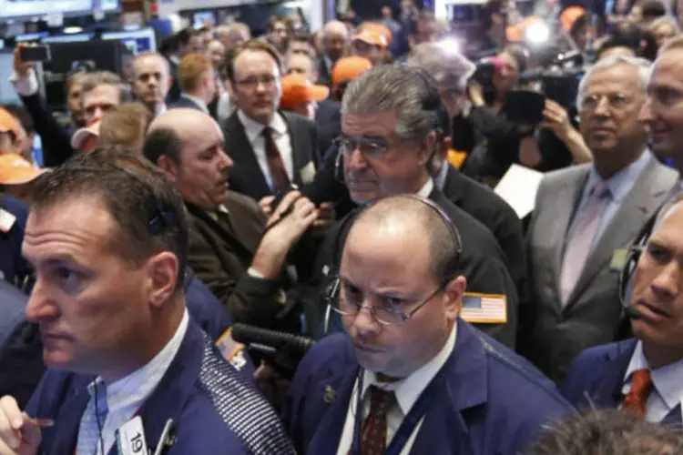 
	Bolsa de Nova York: &agrave;s 12h15 (de Bras&iacute;lia), o Dow Jones futuro perdia 0,30%, o Nasdaq tinha alta marginal de 0,01%
 (REUTERS/Brendan McDermid)