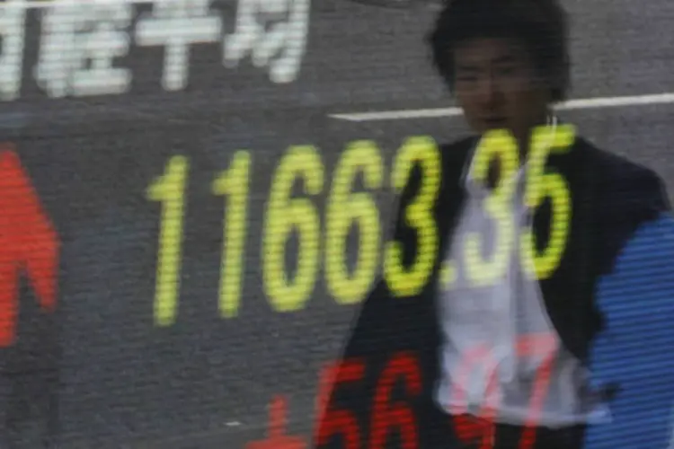 
	Bolsa de T&oacute;quio: o &iacute;ndice Nikkei ganhou 2,1%, fechando a sess&atilde;o com 11.932,27 pontos, ap&oacute;s aumento de 0,3% no preg&atilde;o anterior
 (REUTERS/Yuya Shino)