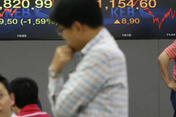 
	Na Coreia do Sul, o &iacute;ndice Kospi Composite ganhou 0,3% e terminou a sess&atilde;o aos 1.875,16 pontos
 (REUTERS/Kim Hong-Ji)