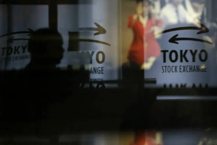 
	Bolsa de T&oacute;quio: o &iacute;ndice Nikkei caiu 0,4%, para 14.416,60 pontos, ap&oacute;s alta de 2,6% na sess&atilde;o anterior.
 (REUTERS/Toru Hanai)