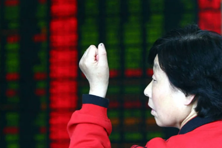 
	O &iacute;ndice Xangai Composto subiu 1,2%, para 2.321,32 pontos, o n&iacute;vel de fechamento mais alto desde 25 de mar&ccedil;o quando havia ficado em 2.326,72 pontos
 (Getty Images)