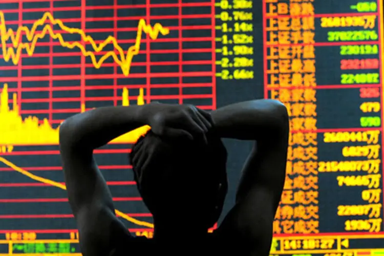 
	O &iacute;ndice Xangai Composto caiu 0,3%, para 2.219,55 pontos e o &iacute;ndice Shenzhen Composto recuou 0,3%, para 919,12
 (Getty Images)