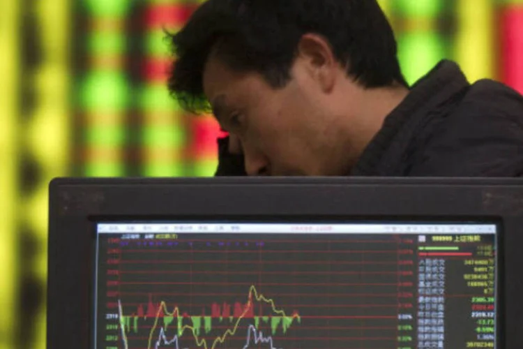 
	Bolsa de Xangai: o mercado recuou 0,26 por cento em Hong Kong e a bolsa de Taiwan avan&ccedil;ou 0,87 por cento, enquanto o &iacute;ndice referencial de Xangai perdeu 1,02 por cento
 (Getty Images)
