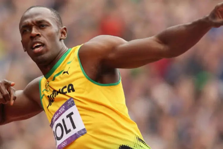 
	Corredor Usain Bolt comemora vit&oacute;ria nos Jogos Ol&iacute;mpicos de Londres: &quot;n&atilde;o sei o qu&atilde;o bom serei. Provavelmente terei que treinar muito&quot;, disse
 (Streeter Lecka/Getty Images)