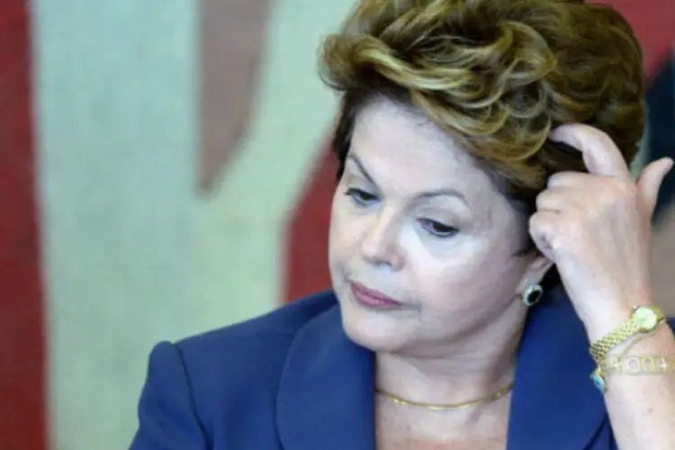 
	Dilma Rousseff: rea&ccedil;&atilde;o ocorreu depois que a presidente disse que o PMDB n&atilde;o ampliaria seu espa&ccedil;o na Esplanada dos Minist&eacute;rios
 (EVARISTO SA/AFP/Getty Images)