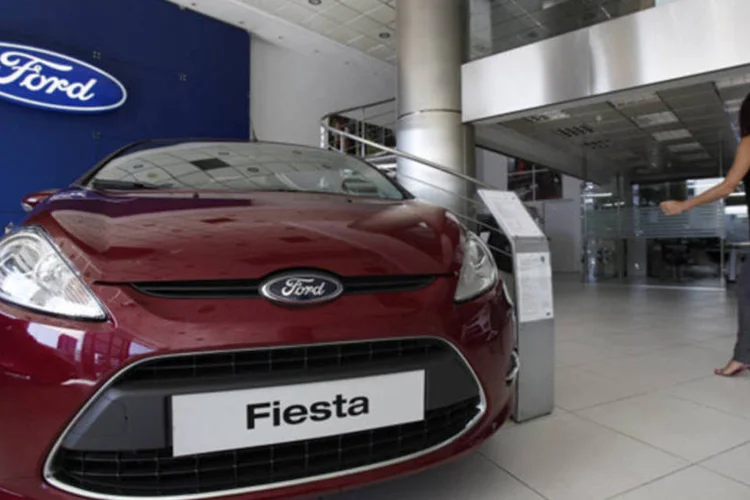 
	Concession&aacute;ria da Ford: empresa espera que o lucro total antes de impostos seja maior que os 8 bilh&otilde;es de d&oacute;lares do ano passado
 (Kostas Tsironis/Bloomberg)