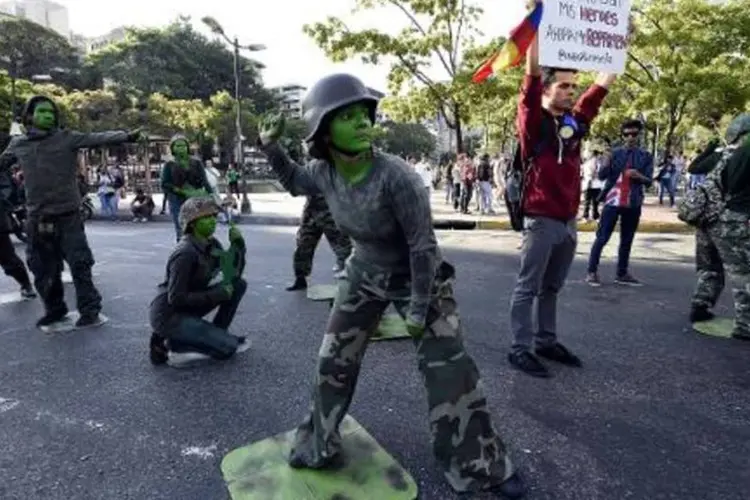 
	Protesto de estudantes contra a repress&atilde;o do governo aos protestos na Venezuela, em Caracas, em 11 de abil de 2014
 (AFP)