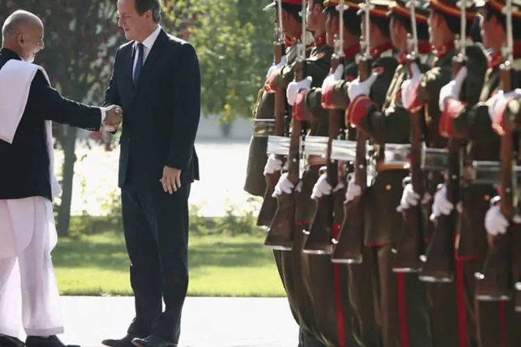 Cameron e Ashraf Ghani: Grã-Bretanha é o segundo maior contribuinte para a coligação militar internacional que está no Afeganistão desde 2001 (Dan Kitwood/Reuters)