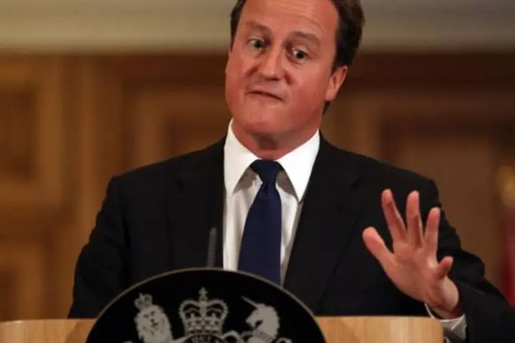 David Cameron foi criticado por continuar de férias enquanto Londres registrava três dias de distúrbios (Peter Macdiarmid/Getty Images)