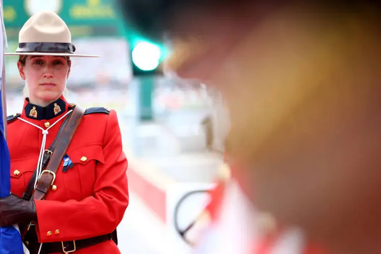 
	Pol&iacute;cia montada: o uniforme da pol&iacute;cia montada - uma t&uacute;nica vermelha, botas e chap&eacute;u - &eacute; um &iacute;cone no Canad&aacute;
 (Mark Thompson/Getty Images)