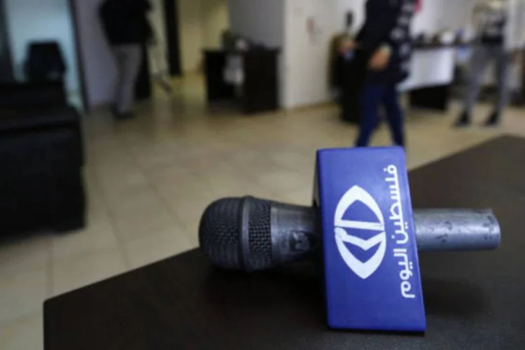 
	Palestina: &quot;Falestin Al Yom&quot; divulga informa&ccedil;&atilde;o atrav&eacute;s da televis&atilde;o, internet e redes sociais, e seus funcion&aacute;rios se encontram no L&iacute;bano
 (Abbas Momani / AFP)