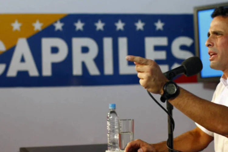 
	Capriles, que se negou a participar do processo de auditoria denunciando uma farsa, perdeu por uma diferen&ccedil;a de 1,49 ponto percentual para Maduro, eleito como sucessor do falecido presidente Hugo Ch&aacute;vez
 (REUTERS/Carlos Garcia Rawlins)