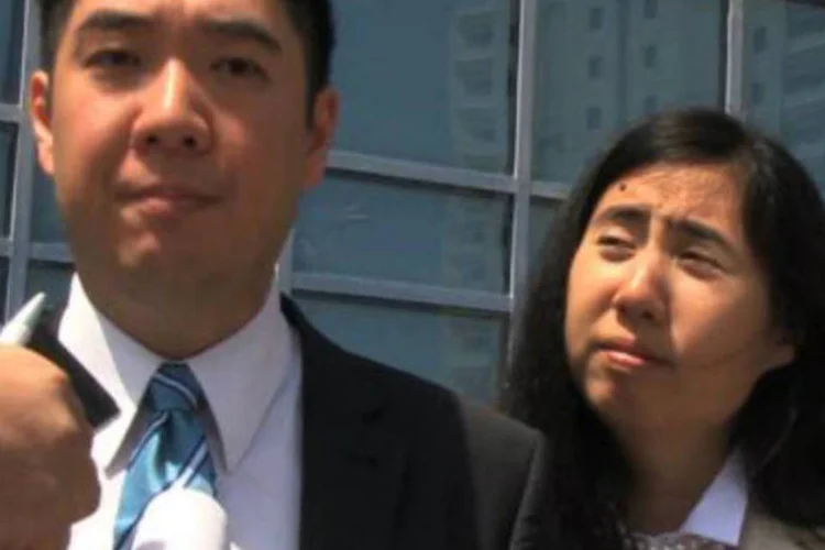O casal Matthew e Grance Huang: os dois americanos serão expulsos do Catar quando tiverem cumprido sua pena (Victoria Baux/AFP)