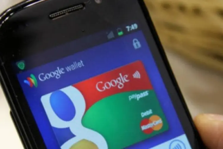 
	Celular com app Wallet, do Google: ju&iacute;za disse que o Google elevou o risco de roubo de identidade
 (Flickr.com/feuilllu)