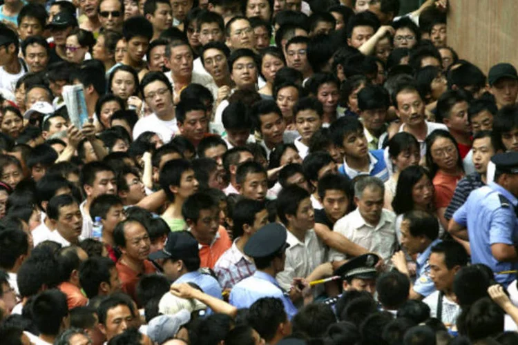 
	Fila: &quot;H&aacute; gente&quot; significa o mesmo que &quot;existem pessoas&quot;
 (China Photos/Getty Images)