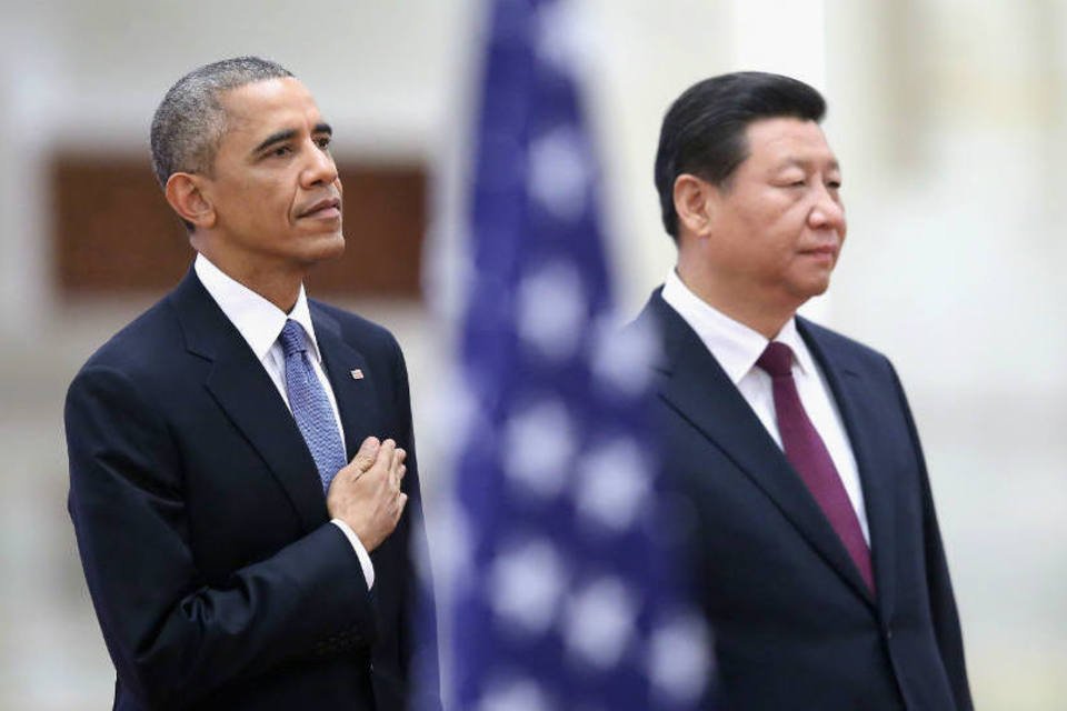 
	O presidente americano Barack Obama (E) e o presidente chin&ecirc;s Xi Jinping
 (Feng Li/Getty Images)