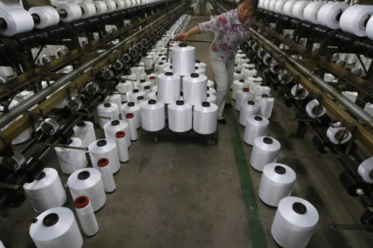 
	Ind&uacute;stria t&ecirc;xtil na China: &eacute; o nono m&ecirc;s consecutivo em que os n&uacute;meros oficiais indicam uma expans&atilde;o da atividade industrial chinesa
 (REUTERS/William Hong)