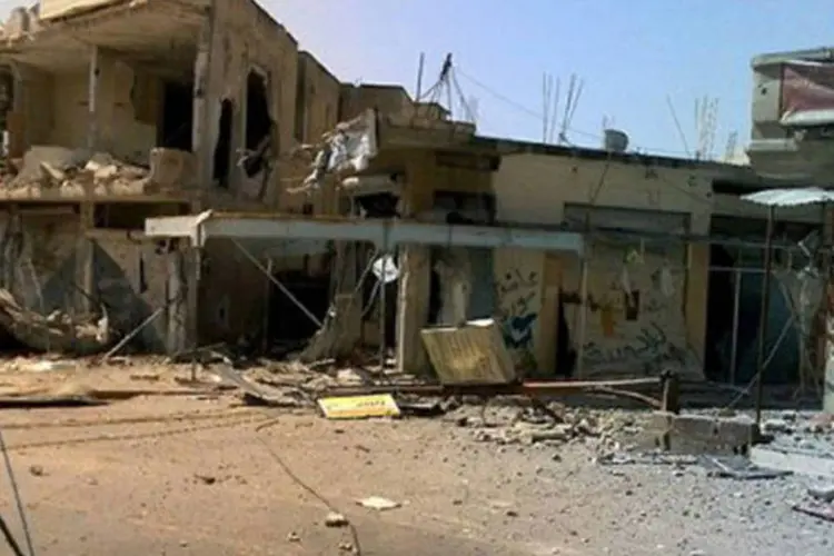 Nove pessoas morreram, incluindo três civis, devido a foguetes e disparos do exército na cidade de Homs
 (AFP)