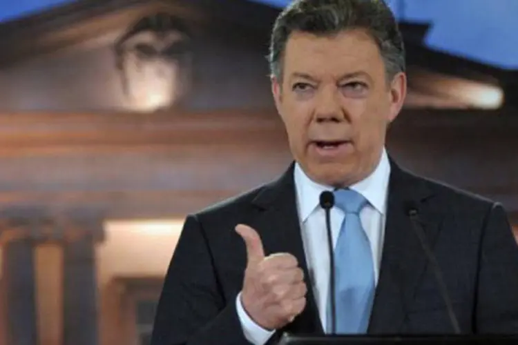 O presidente colombiano Juan Manuel Santos anuncia em 27 de agosto de 2012 em Bogotá a realização de diálogos exploratórios com as Farc
 (Cesar Carrion/AFP)