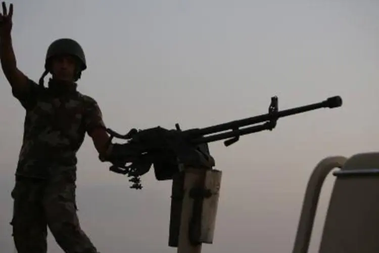 
	Combatente curdo: tropas curdas lutam contra os jihadistas do Estado Isl&acirc;mico
 (Ahmad al-Rubaye/AFP)