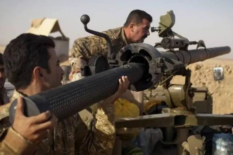 
	Combatentes curdos iraquianos durante combates: Ir&atilde; pediu esfor&ccedil;o global contra EI
 (J.M Lopez/AFP)