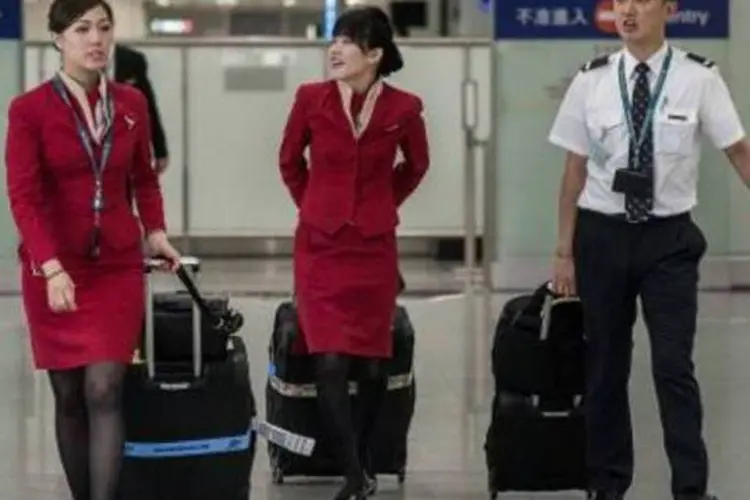 
	Comiss&aacute;rias da Cathay Pacific:&nbsp;elas &quot;est&atilde;o preocupadas com o uniforme curto demais&quot; que usam para trabalhar, disse o vice-presidente do FAU avaliando que a roupa pode ser causa de ass&eacute;dio sexual

	
	
 (AFP)