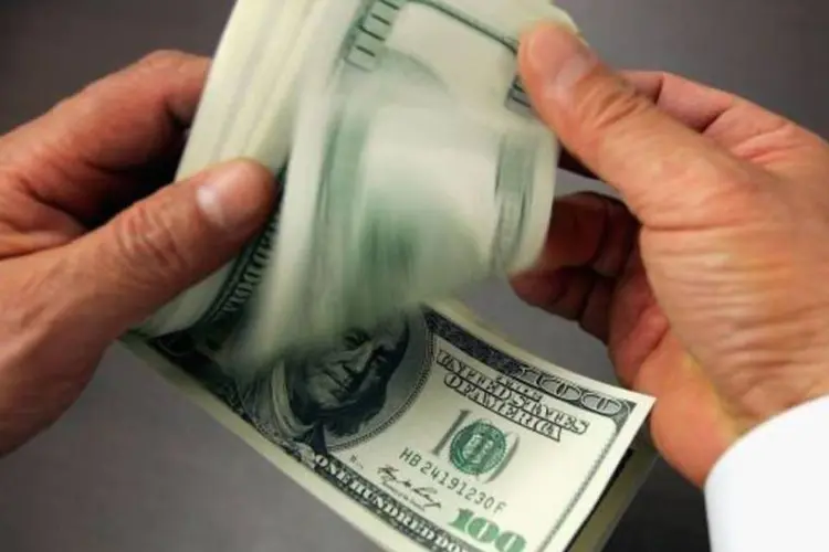 Em relação a uma cesta de moedas, o dólar recuava cerca de 0,20 por cento (Getty Images)