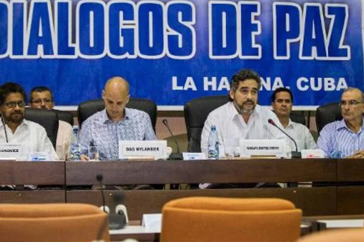 
	Acordo: &quot;N&atilde;o &eacute; ret&oacute;rica dizer que o an&uacute;ncio do acordo sobre os direitos das v&iacute;timas prev&ecirc; o poss&iacute;vel fim do conflito e o advento de uma paz firme&quot;
 (Yamil Lage/AFP)