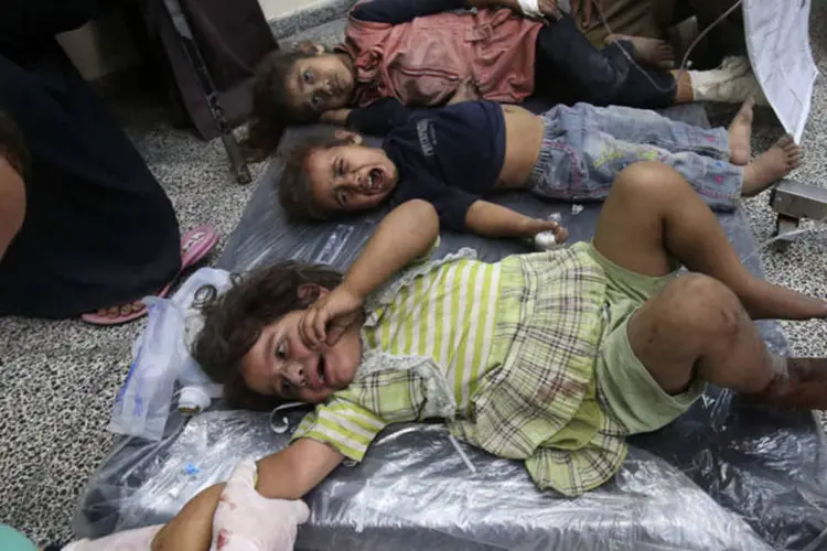 
	Crian&ccedil;as palestinas: bombardeios israelenses afetaram 142 escolas em Gaza
 (Ibraheem Abu Mustafa/Reuters)