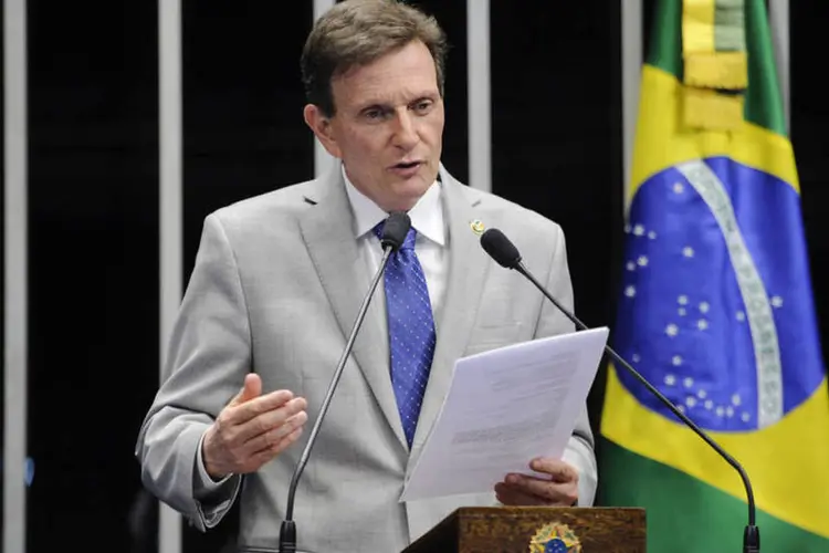 
	O senador Marcelo Crivella: a proposta PLS 782/2015 pode instituir cobran&ccedil;a para alunos que tenham renda familiar superior a 30 sal&aacute;rios m&iacute;nimos
 (Divulgação/Marcelo Crivella)