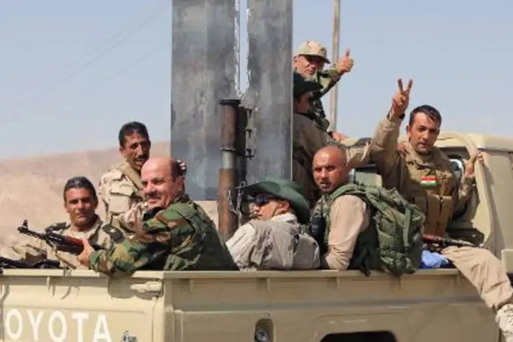 
	Combatentes curdos: &quot;ajudaremos os &quot;peshmerga&quot; a entrar em Kobane, disse ministro
 (Ahmad al-Rubaye/AFP)