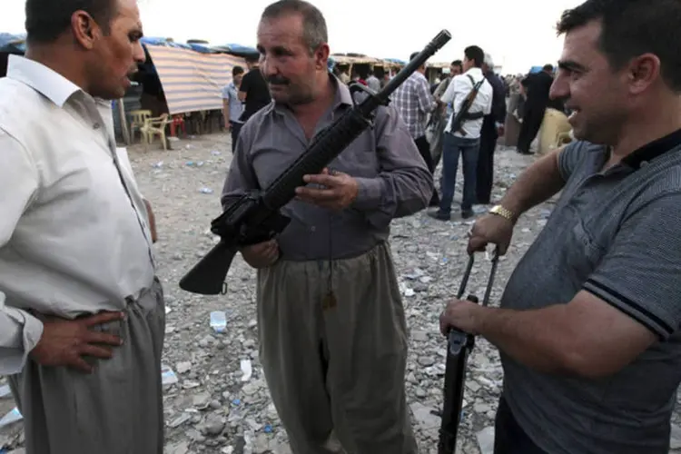 Curdos vendem armas em Mosul: autoridades iraquianas saudaram o que disseram ter sido uma vitória estratégica (Azad Lashkari/Reuters)