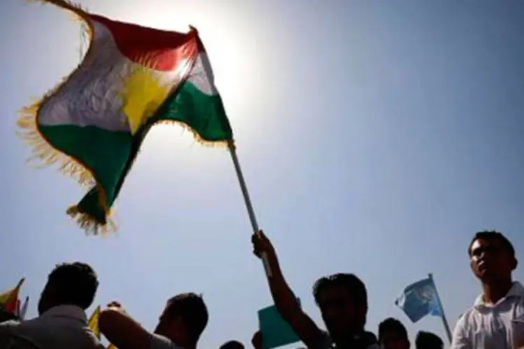 Curdos iraquianos simpatizantes do Partido dos Trabalhadores do Curdistão (PKK) em manifestação contra o Estado Islâmico (EI) em 20 de setembro
 (Safin Hamed/AFP)