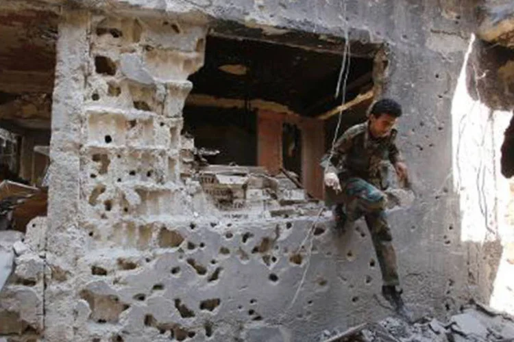 Destroços do campo de refugiados de Yarmouk são vistos em 12 de setembro de 2013 (AFP)