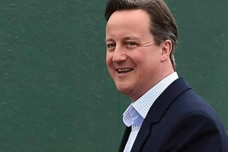 
	O primeiro-ministro brit&acirc;nico David Cameron: partido dos conservadores voltou ao poder com uma maioria direta
 (Paul Ellis/AFP)