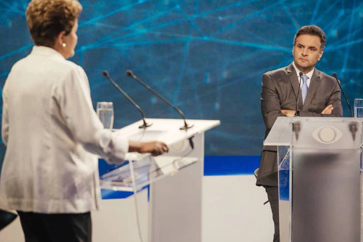
	Dilma Rousseff (PT) e A&eacute;cio Neves (PSDB) no primeiro debate do 2&ordm; turno na Rede Bandeirantes
 (Filipe Redondo/BAND)
