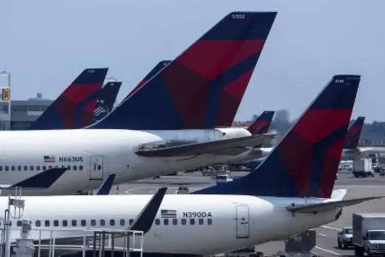 Um avião da Delta Airlines no Terminal 4 do Aeroporto John F. Kennedy, em Nova York: FAA proibiu voos comerciais sobre o Iraque (Eric Thayer/AFP)