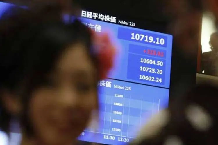 
	Desempenho do Nikkei &eacute; mostrado em tel&atilde;o da Bolsa de T&oacute;quio: o &iacute;ndice subia 1,05% na abertura da sess&atilde;o de ter&ccedil;a-feira
 (REUTERS/Toru Hanai)