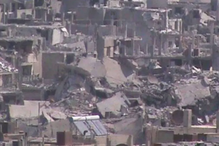 
	Imagem da destrui&ccedil;&atilde;o na cidade s&iacute;ria de Homs: em toda a S&iacute;ria, 59 pessoas morreram nesta segunda-feira
 (AFP)