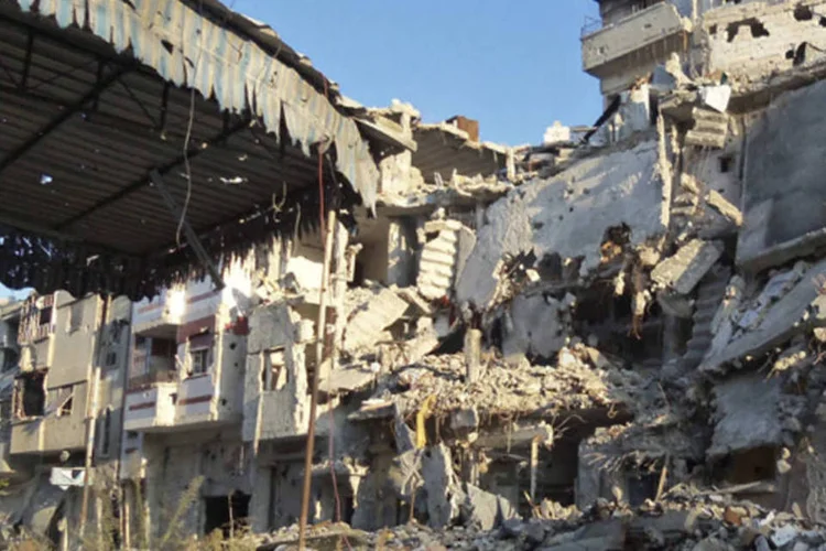 
	Pr&eacute;dios destru&iacute;dos em Homs, na S&iacute;ria: conhecida como &quot;a capital da Revolu&ccedil;&atilde;o&quot;, a cidade est&aacute; controlada em 80% pelo Ex&eacute;rcito
 (REUTERS)