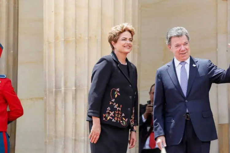 
	Dilma em visita oficial a Col&ocirc;mbia ao lado de Juan Manuel Santos: Espera-se a assinatura de acordos comerciais
 (Agência Brasil)