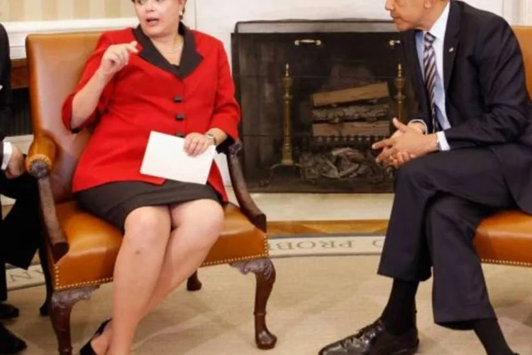 Dilma com Obama: a conversa foi boa, mas ele não 
pode fazer nada para impedir que o Brasil atraia dólares (Chip Somodevilla/Getty Images)