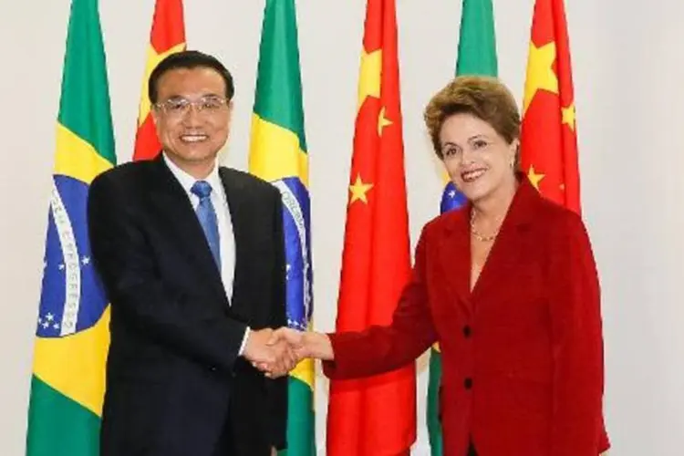 
	O primeiro-ministro chin&ecirc;s acaba de concluir um tour por quatro pa&iacute;ses latino americanos, onde anunciou grandes programas de investimento da China na regi&atilde;o
 (HO/AFP)