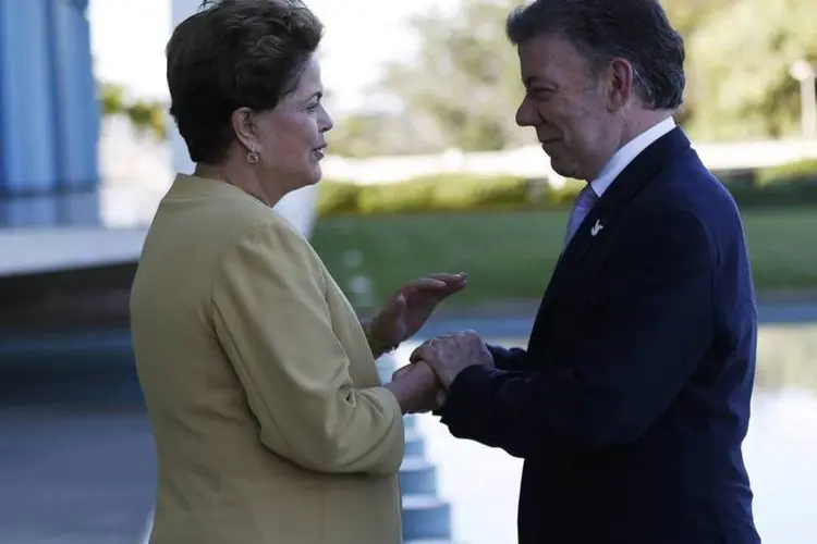 
	Dilma Rousseff e Juan Manuel Santos: Presidente colombiano elogiou a organiza&ccedil;&atilde;o da Copa no Brasil
 (Ueslei Marcelino/Reuters)