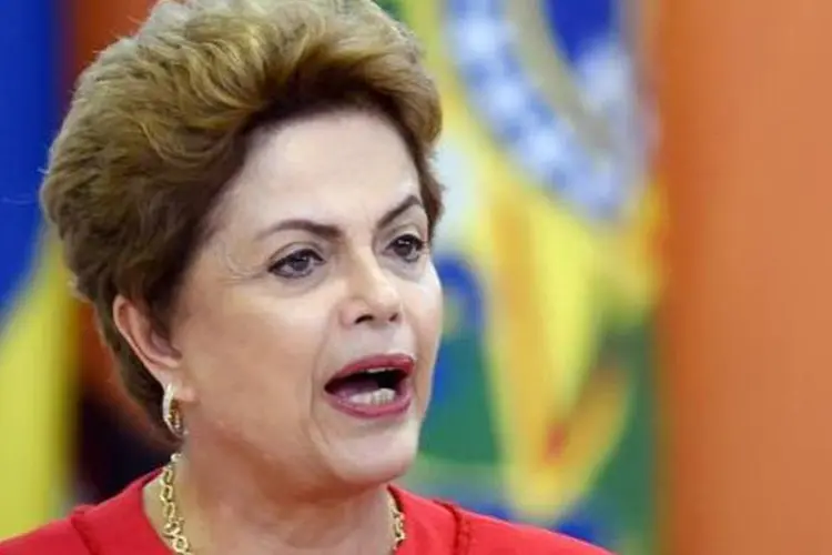 
	A presidente Dilma Rousseff: ela voltou a afirmar que o impacto da crise econ&ocirc;mica internacional de 2008 ainda &eacute; sentido
 (EVARISTO SA/AFP)