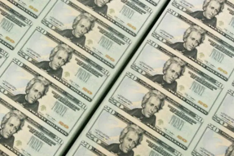 
	D&oacute;lar:&nbsp;os ativos totais sob administra&ccedil;&atilde;o da empresa alcan&ccedil;aram recorde de 218 bilh&otilde;es de d&oacute;lares no final do trimestre, 15&nbsp;%&nbsp;acima do registrado um ano antes.
 (Mark Wilson/Getty Images)