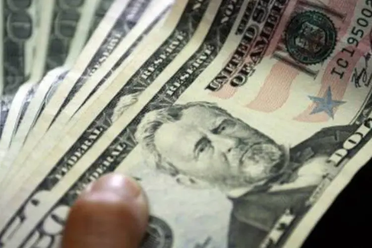 Dólar: o BC novamente não anunciou intervenção no mercado de câmbio neste pregão (Juan Barreto/AFP)