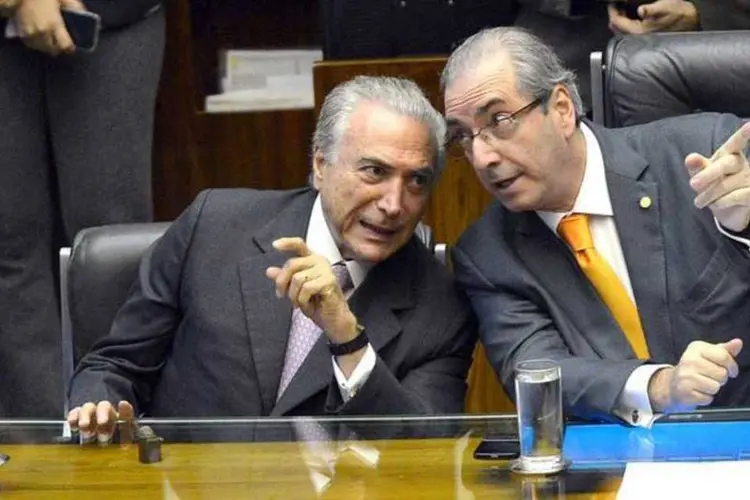 
	Eduardo Cunha e Michel Temer: presidente afastado da C&acirc;mara negou ter encontrado o presidente interino
 (Antonio Cruz/Agência Brasil)