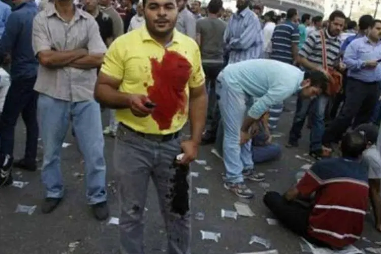Simpatizante da Irmandade Muçulmana no bairro de Abbassiya do Cairo em 16 de agosto (©afp.com / Mohammed Abdel Moneim)